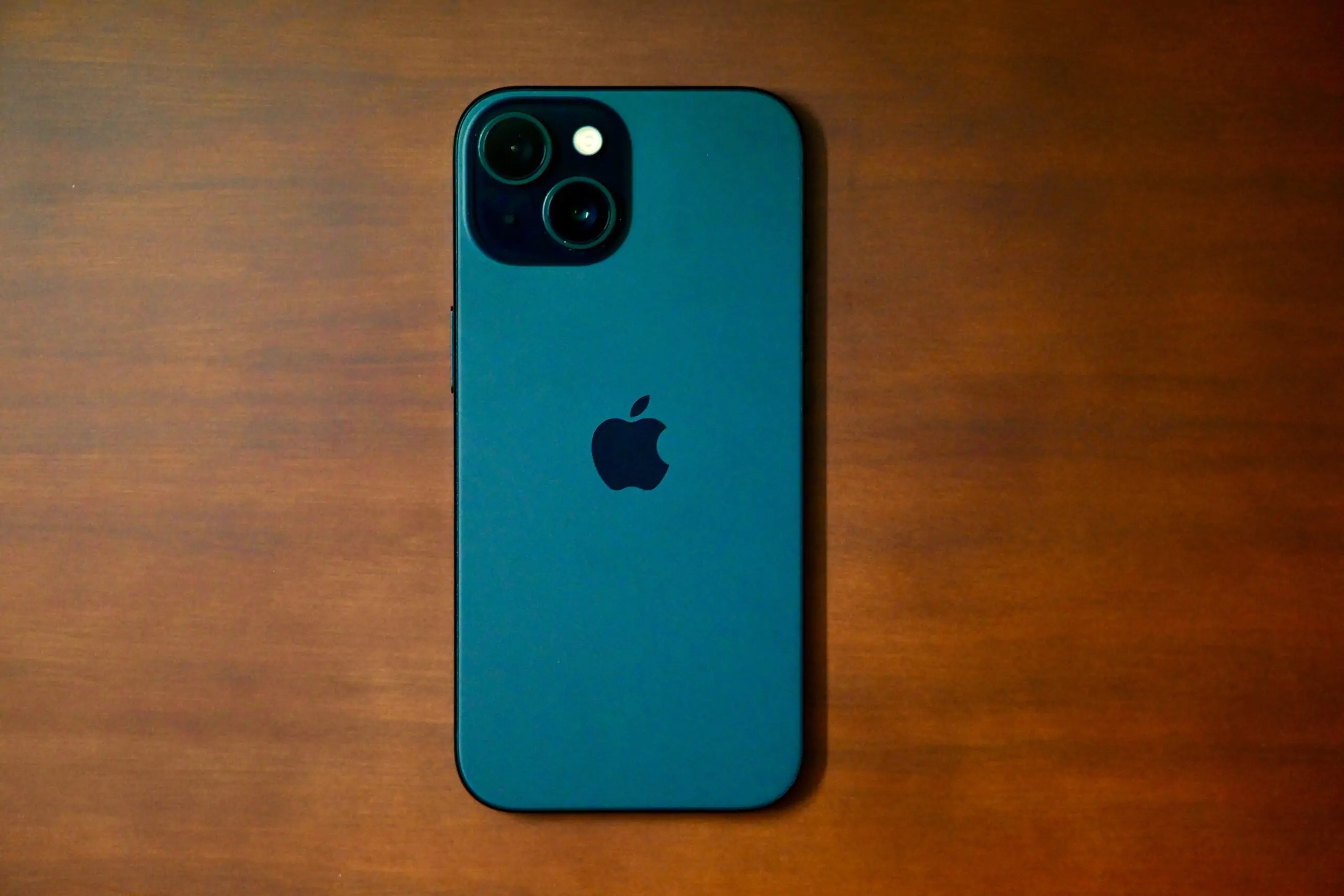 iPhone 15 on a desk